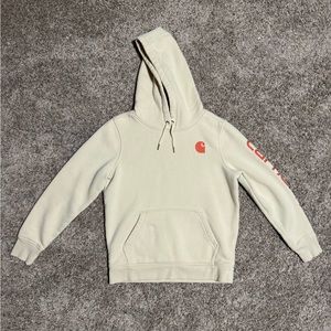 Pale yellow Carhartt hoodie with orange logo